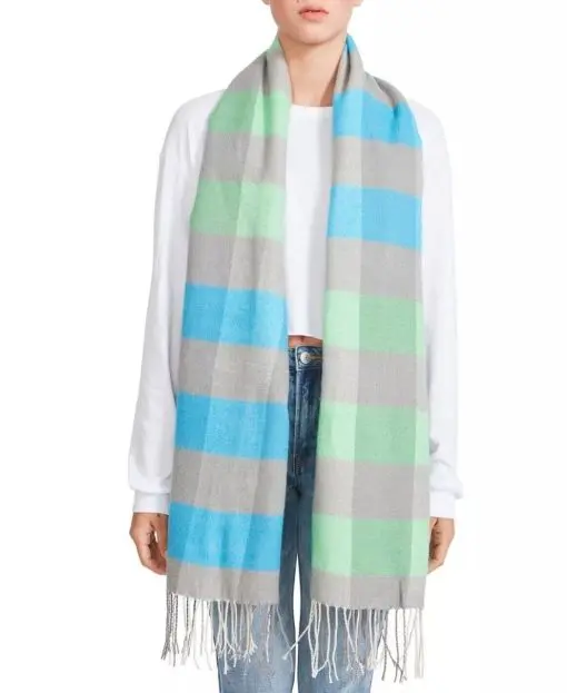 Steve Madden mixes two trends for an effortlessly chic look on this cozy colorblocked buffalo check scarf.